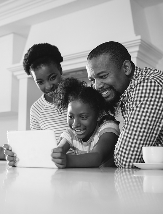African American Family looking at tablet