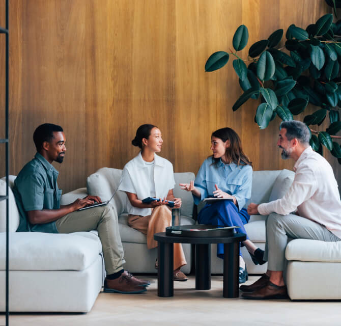 group of coworkers in casual conversation