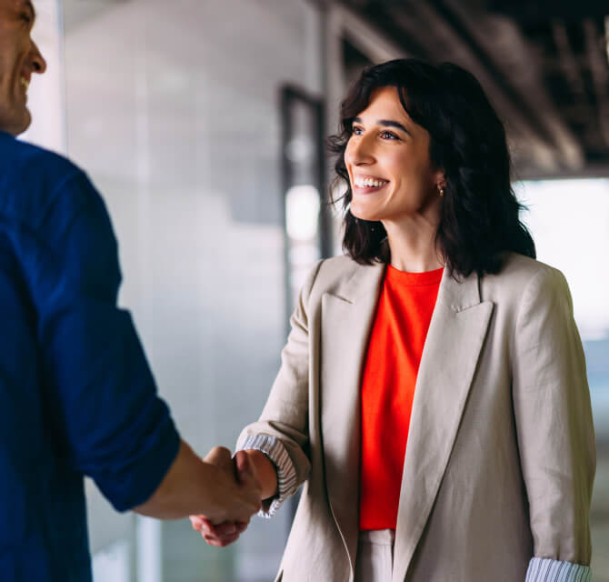 Two businesspeople handshaking