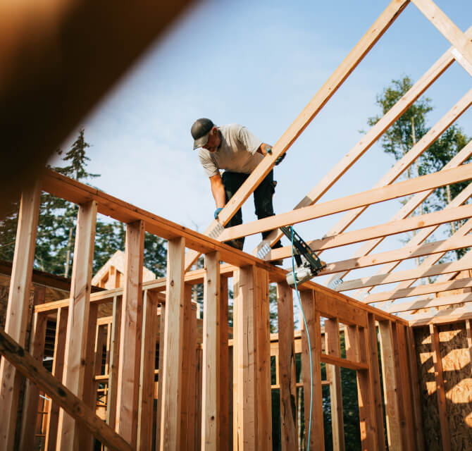 man helping build a home